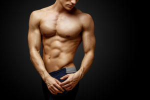Getting Your Beach Body Ready with a Men’s Tummy Tuck Stock Photo