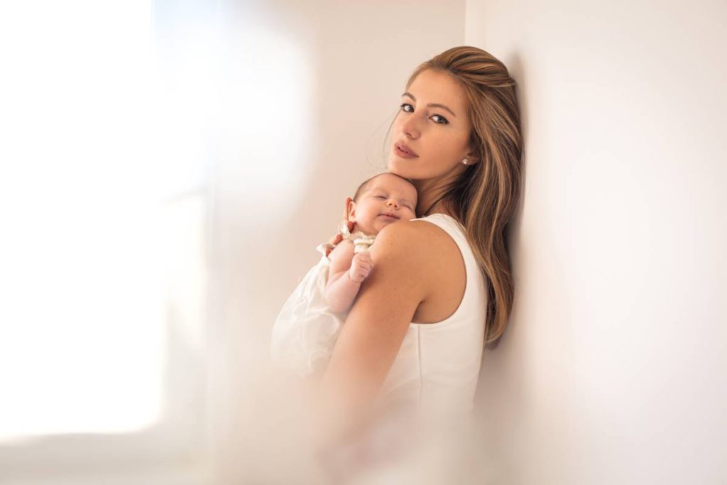 How A Mommy Makeover Helps Mothers Stock Photo