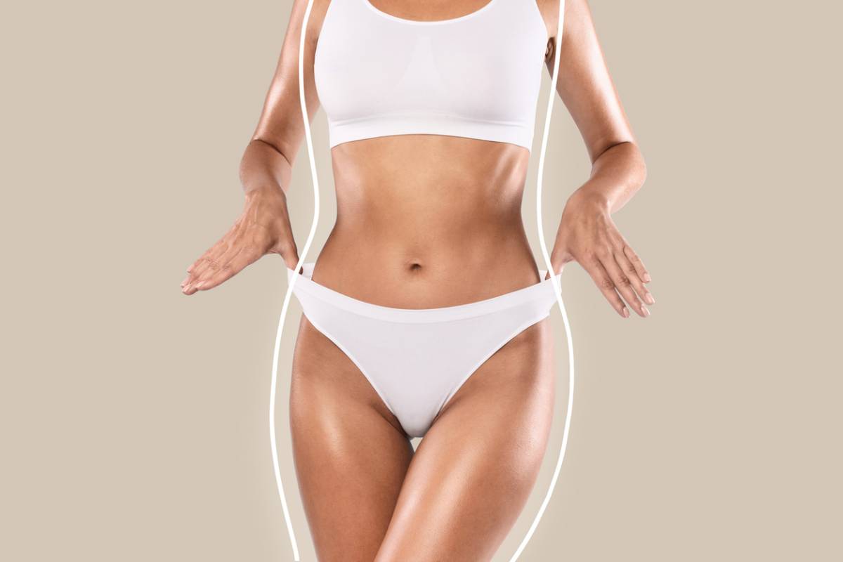 A woman wearing a white bikini top and matching underwear, posing confidently against a neutral background.